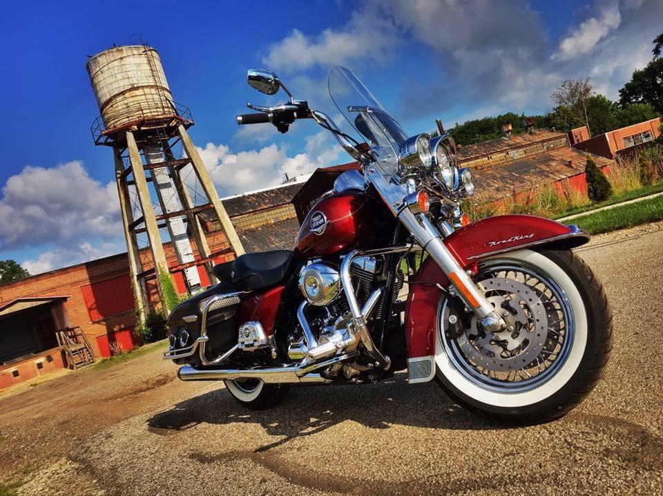 Red Harley-Davidson Road King with whitewall tires