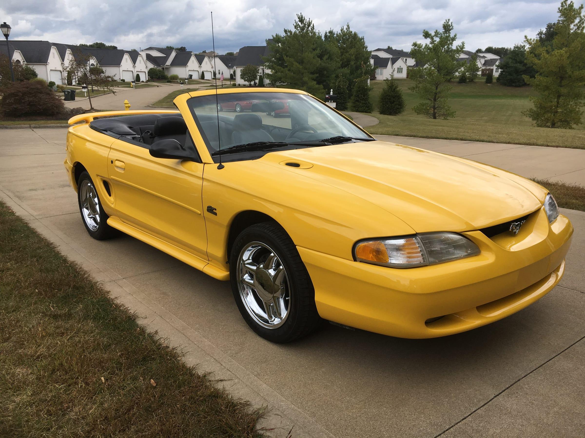 Yellow 1994 Ford Mustang GT convertible