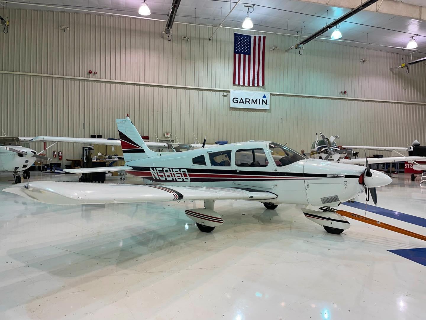 Piper Cherokee Challenger in a hangar